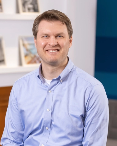 portrait of a smiling person in professional attire